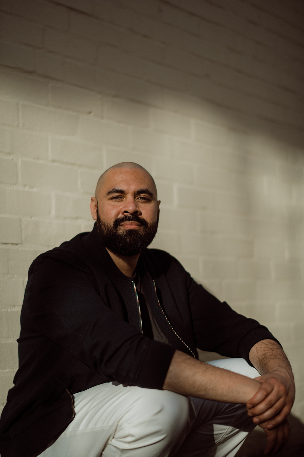 Bjorn Stewart sitting with hands folded